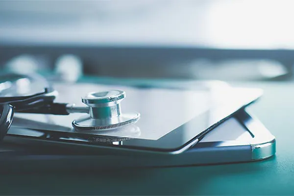 AIMD-Approach-Clinic Close up of a stethoscope lying on a tablet. Representing the advanced diagnostic and DNA testing offered with the AIMD® approach by AZENA Health & Longevity in Gainesville.
