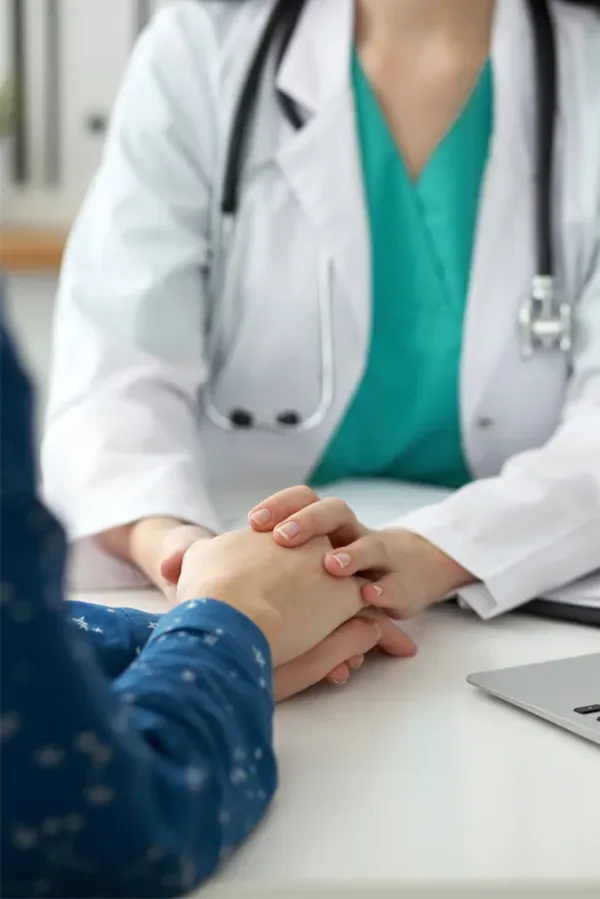 Health-and-Wellness-Services-Treatment-3 A clinician holds hands with a patient with compassion. Get concierge health and wellness services from AZENA Health & Longevity in Gainesville.